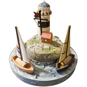 vintage nautical-themed ceramic candle topper
